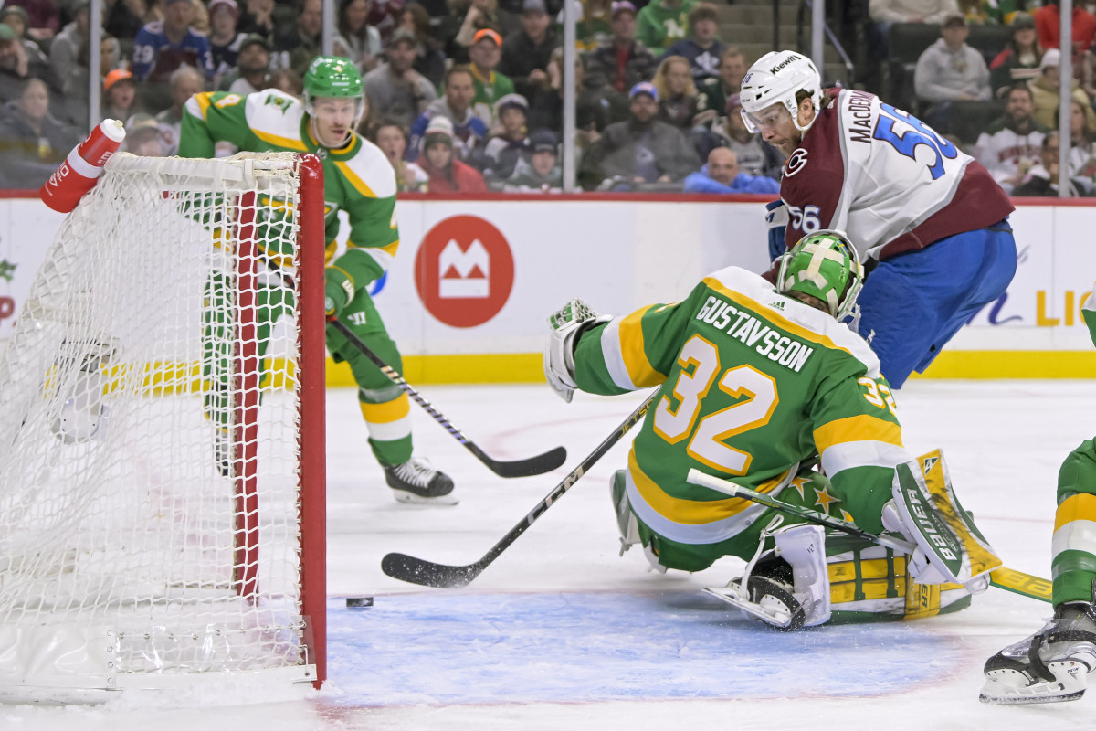 Nov 24, 2023; Saint Paul, Minnesota, USA; Colorado Avalanche defenseman Kurtis MacDermid (56) beats Minnesota Wild goalie Filip Gustavsson (32) for a goal during the third period at Xcel Energy Center.